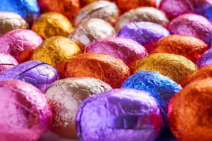 Colorful wrapped Easter eggs displayed closely together. Colorful wrapped Easter eggs displayed closely together.