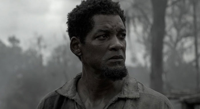 Actor in a dramatic scene showcasing dedication and commitment to difficult roles in challenging film settings.