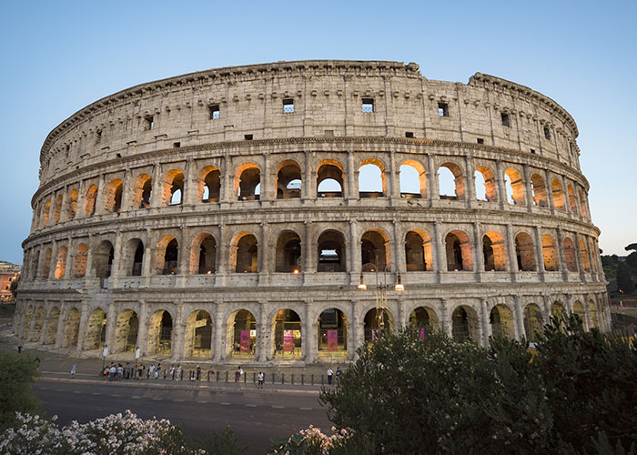 The Colosseum in Rome at sunset, a popular destination for American travelers visiting Europe.