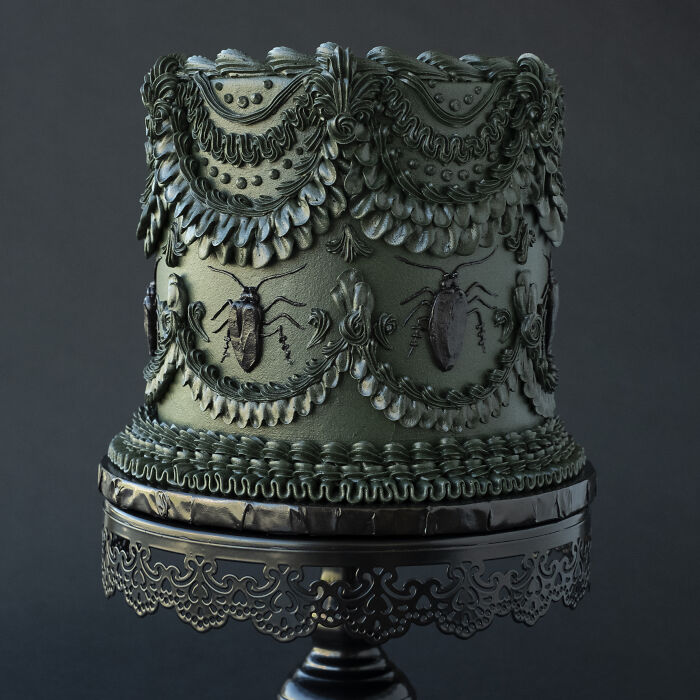 Vegan cake decorated with intricate designs featuring bugs, showcasing stunning edible art.