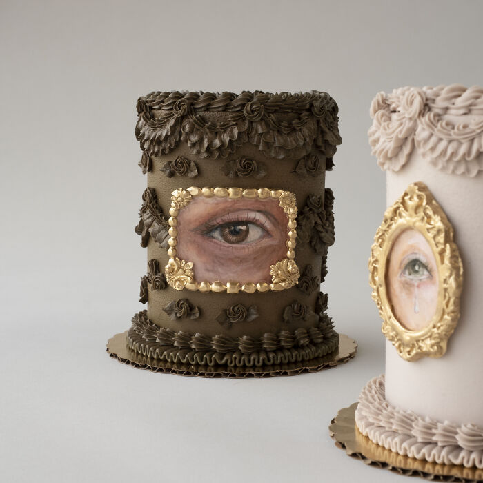 Decorative cakes featuring intricate eye designs with floral icing elements, showcasing stunning artistic detail.