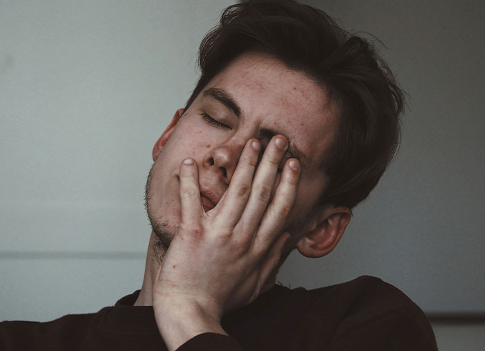 A person looking distressed, symbolizing the end of great friendships.