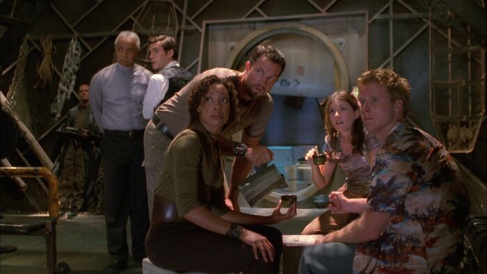 Sci-fi show cast gathered in a spaceship scene, evoking a 10/10 series moment.