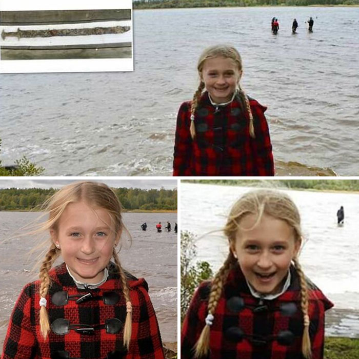Girl by a lake smiling, wearing a plaid coat, relates to a forbidden story about a sword discovery; water in the background.