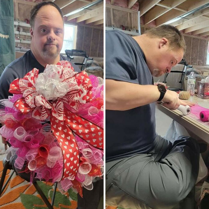 Man crafting a decorative wreath with heart-patterned ribbons, showcasing creativity and artistry in storytelling.