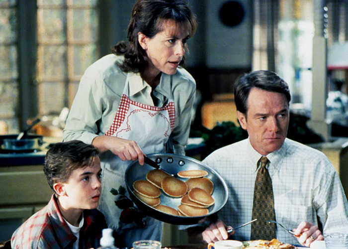 Malcolm in the Middle family breakfast scene with Frankie Muniz looking surprised as pancakes are served.