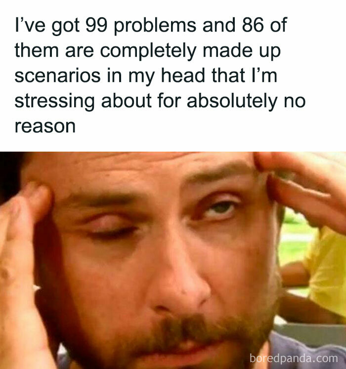 Man holding his head with stressed expression, illustrating silly memes about anxiety and overthinking problems humorously.