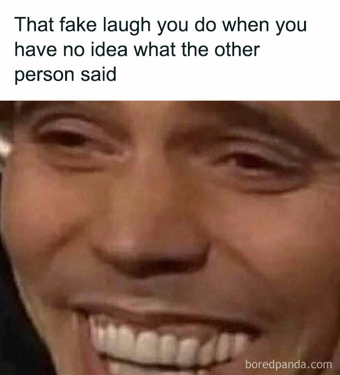 Man smiling awkwardly with caption about fake laughing, from memes about men.