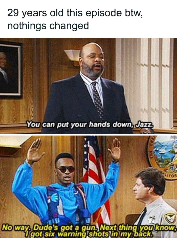 Man in colorful jacket with hands up in courtroom meme humor.