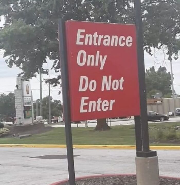 Confidently incorrect sign reading "Entrance Only, Do Not Enter" creates a humorous fail moment.
