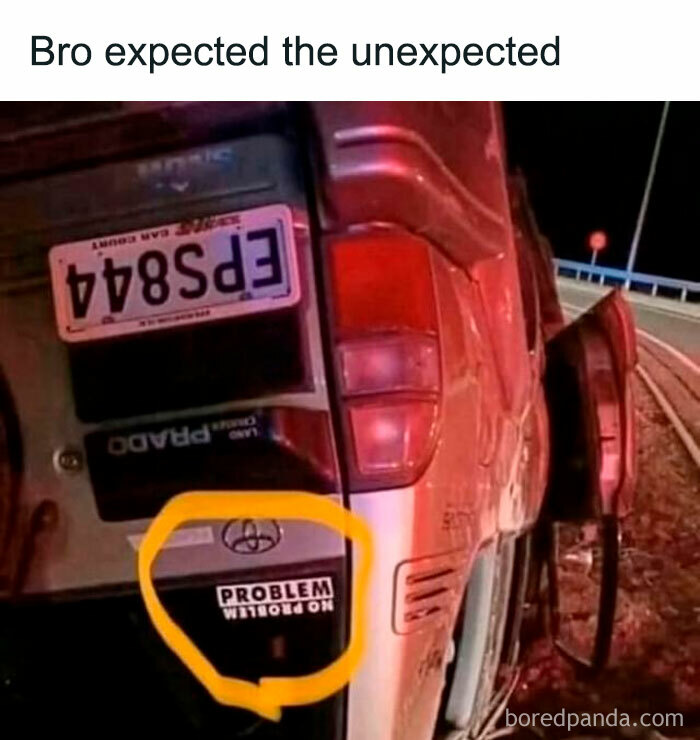 Funny meme of a flipped SUV with a “No Problem” sticker ironically upside down.