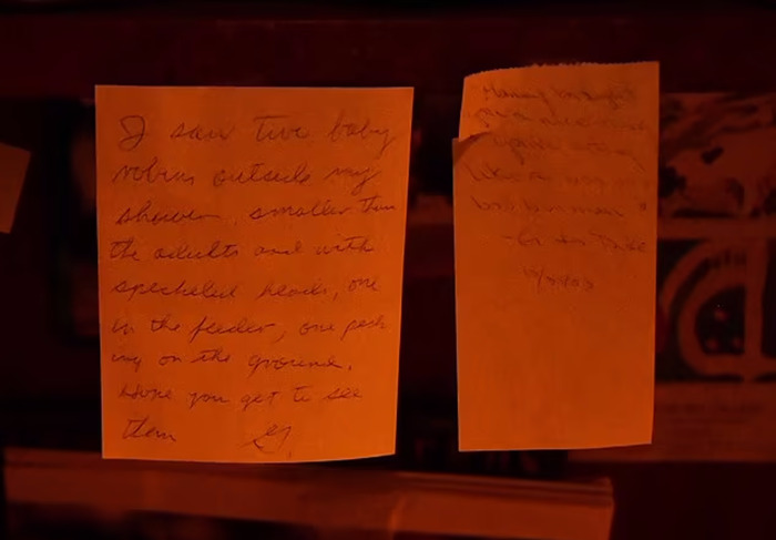 Handwritten notes to Betsy from Gene Hackman, displayed on a dark surface.