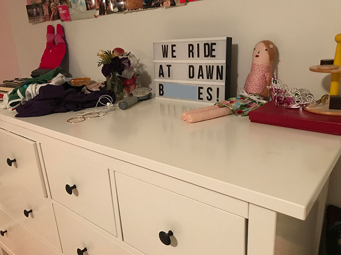 A humorous lightbox message on a dresser, showcasing a man's playful side.