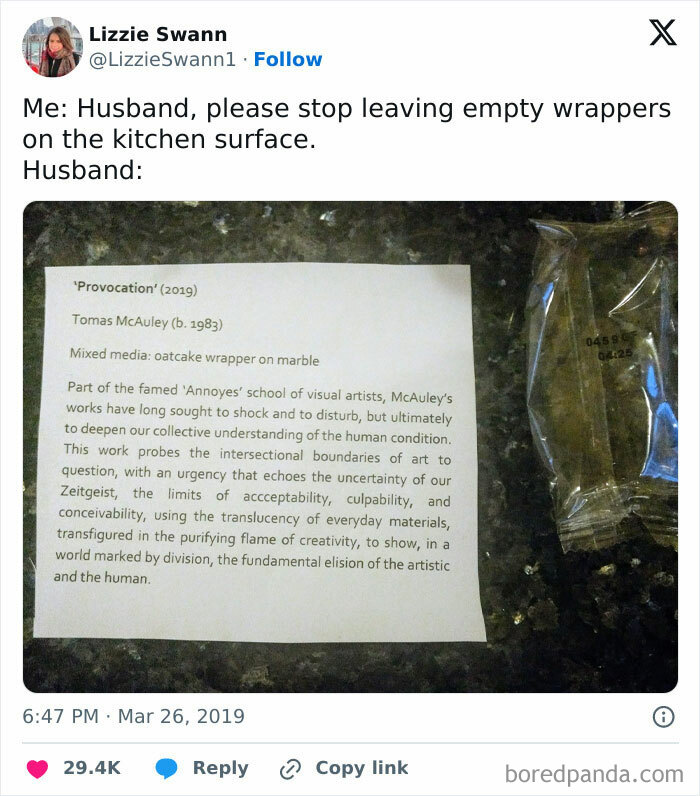 Empty wrapper labeled as art with humorous description, left by a man to entertain his partner.