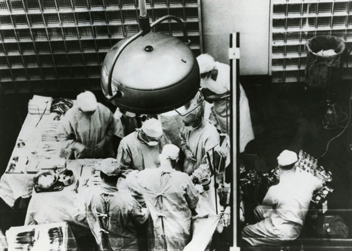Surgeons performing a complex operation, capturing a moment potentially linked to a predicted major historical event.