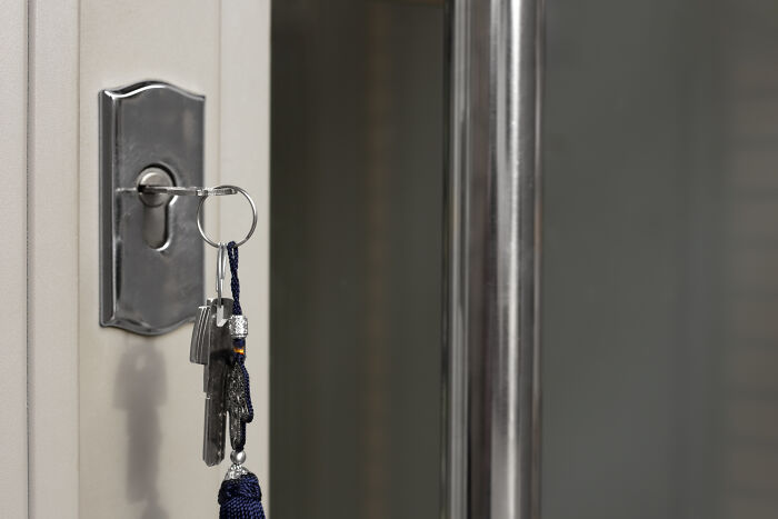 Keys in a lock on a door, symbolizing homeowner first home tips.