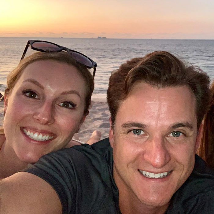 Smiling couple at sunset on the beach, related to news about doctor and wife cliff incident. Smiling couple at sunset on the beach, related to news about doctor and wife cliff incident.