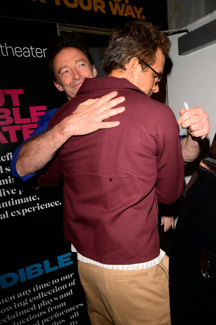 Hugh Jackman and another man hugging at an event, fans urge Hugh Jackman to stay away from Ryan Reynolds and Blake Lively. Hugh Jackman and another man hugging at an event, fans urge Hugh Jackman to stay away from Ryan Reynolds and Blake Lively.