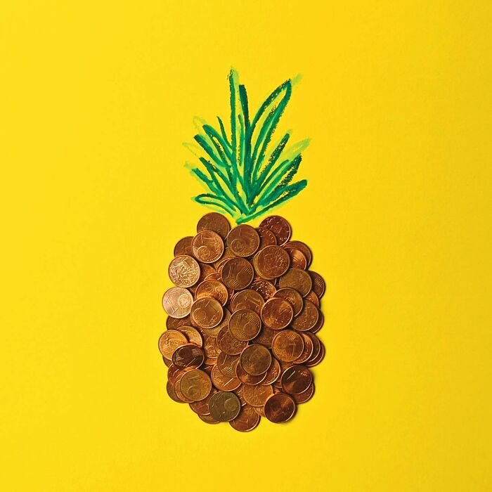 Playful illustration of a pineapple made with coins and green drawing on a yellow background.