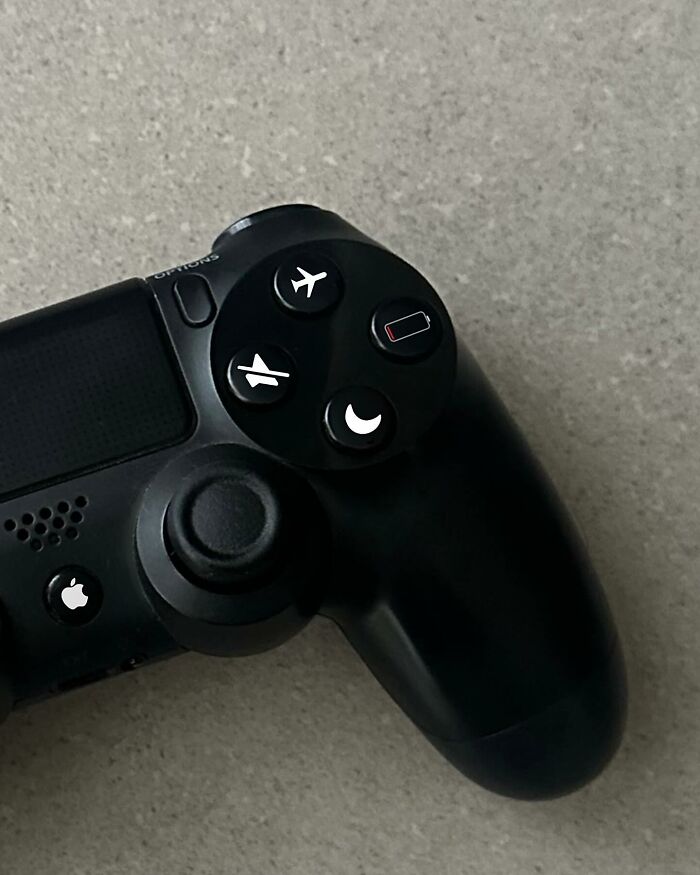 Game controller buttons replaced with unique icons, showcasing an artist's thought-provoking artwork transformation.