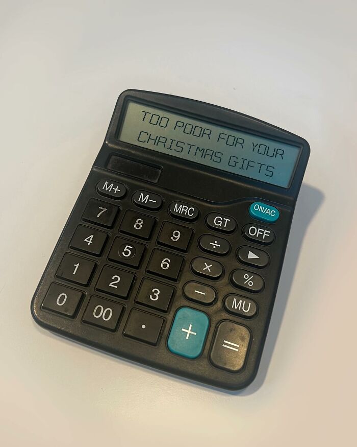 Calculator artwork with the message "Too poor for your Christmas gifts" on display, transforming common items into art.