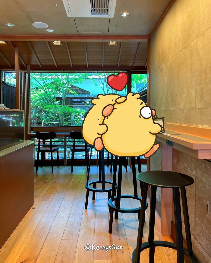 Cute cartoon bird with a heart over its head in a cozy cafe, enjoying the real world by Kenny Mays.
