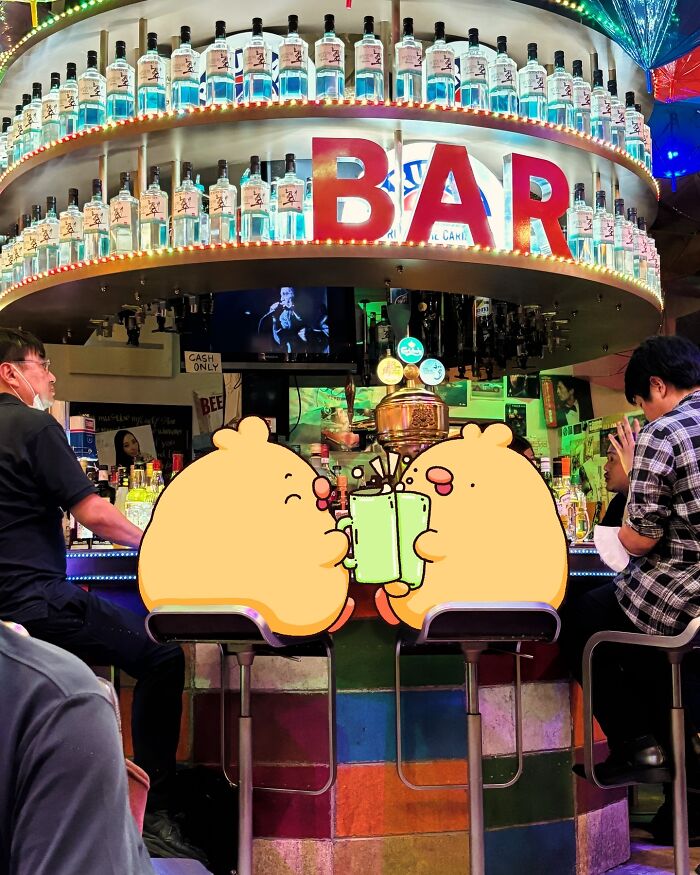 Cartoon characters Birb and Bread at a lively bar, surrounded by colorful bottles and patrons.