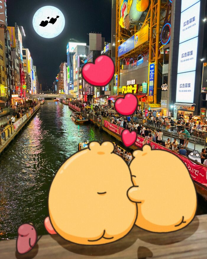 Cute characters overlooking a lively city canal at night, hearts floating above them, with a large moon in the background.