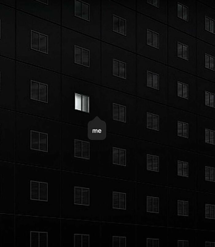 One lit window in a dark building symbolizes unique thought-provoking artwork.