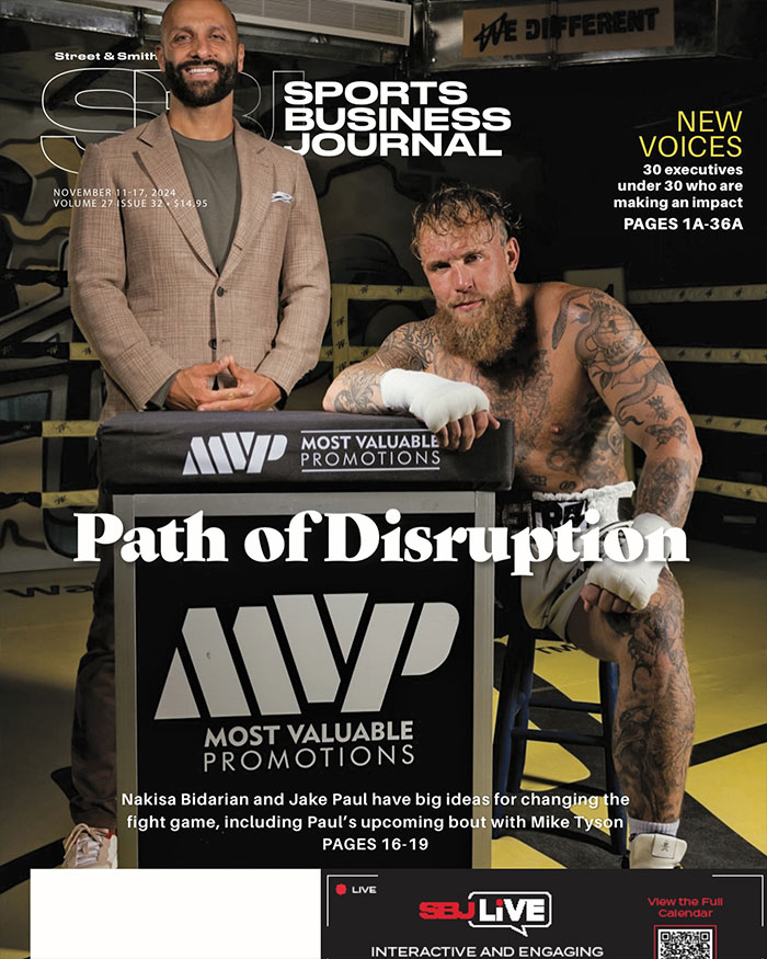 Jake Paul and promoter at MVP event, highlighting Jake Paul's expanding fame beyond YouTube.