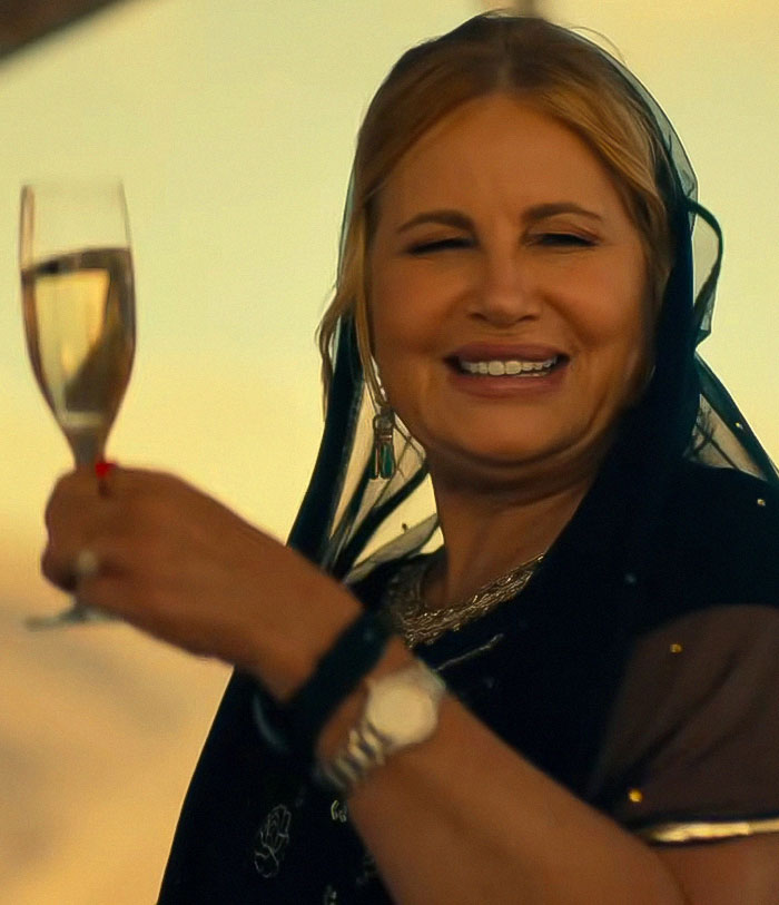 Woman in elegant attire holding a champagne glass, smiling broadly, outdoors at sunset, evoking acceptance and support themes. Woman in elegant attire holding a champagne glass, smiling broadly, outdoors at sunset, evoking acceptance and support themes.