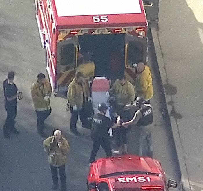 Police and emergency responders at a scene in LA during a manhunt connected to the Weezer bassist incident.