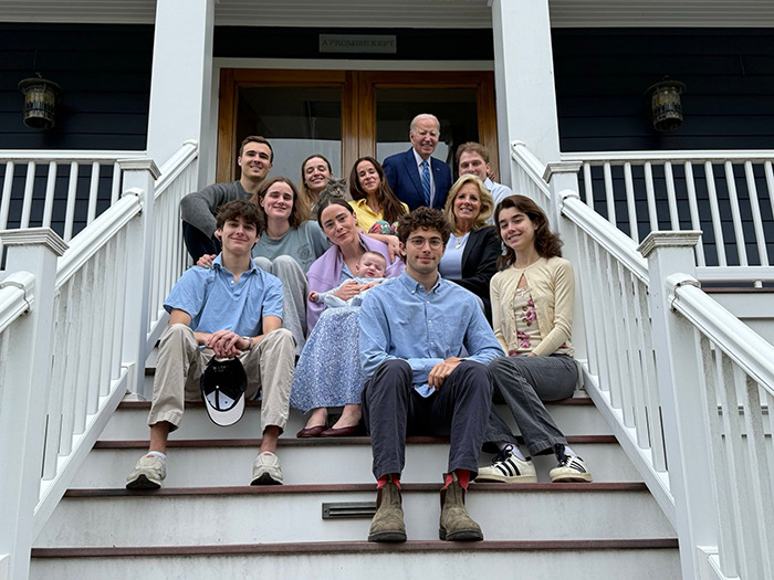 Joe Biden's family Easter photo on steps, featuring a group of relatives, sparking online interest and buzz.