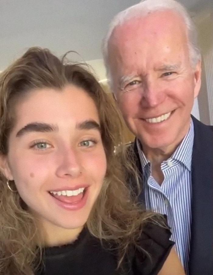 Joe Biden smiles with a young woman, creating buzz online over his Easter family photo.