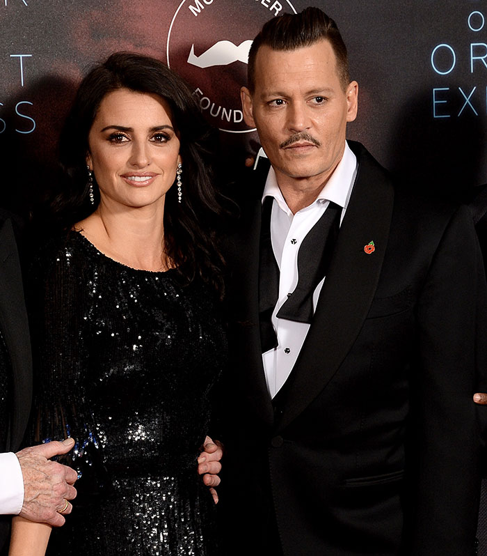 Actor with new look at event, sparking Hollywood debate on cancel culture. Actor with new look at event, sparking Hollywood debate on cancel culture.