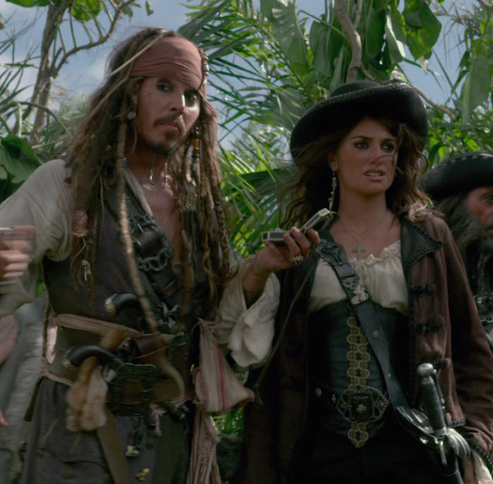 Pirate characters with new look in a lush setting, highlighting Johnny Depp's Hollywood return. Pirate characters with new look in a lush setting, highlighting Johnny Depp's Hollywood return.