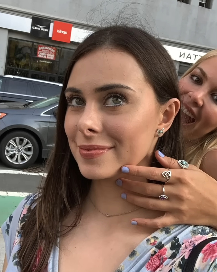 Two smiling women posing outdoors, related to Leonardo DiCaprio's influencer ex story.