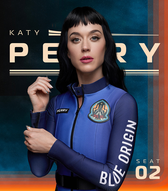 Katy Perry in a Blue Origin spacesuit, standing confidently with folded arms, and wearing a mission badge. Katy Perry in a Blue Origin spacesuit, standing confidently with folded arms, and wearing a mission badge.