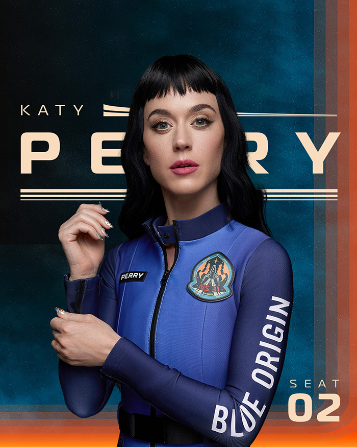 Katy Perry in Blue Origin suit, posing confidently against a branded background.