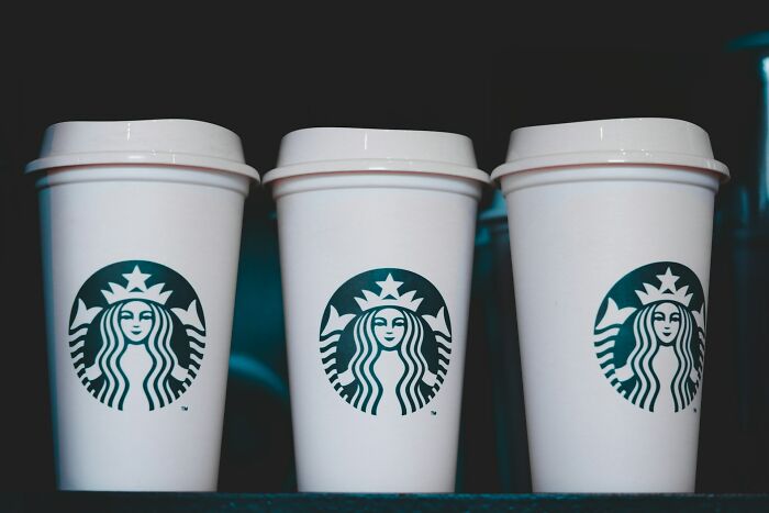 Three Starbucks cups, illustrating consumer loopholes.