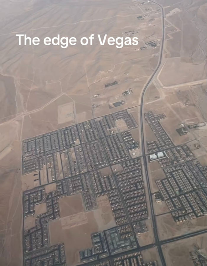 Aerial view of the edge of Vegas showing desert meeting urban sprawl.