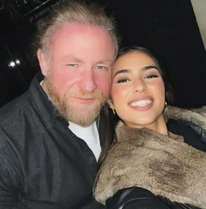 A couple smiling together while on vacation.