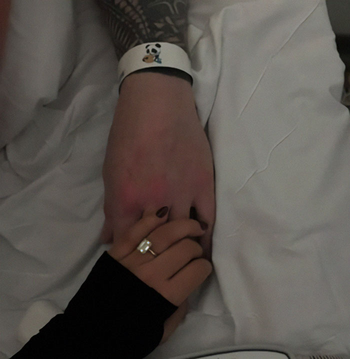 Hands holding in a touching moment, symbolizing love and mystery surrounding burial location.