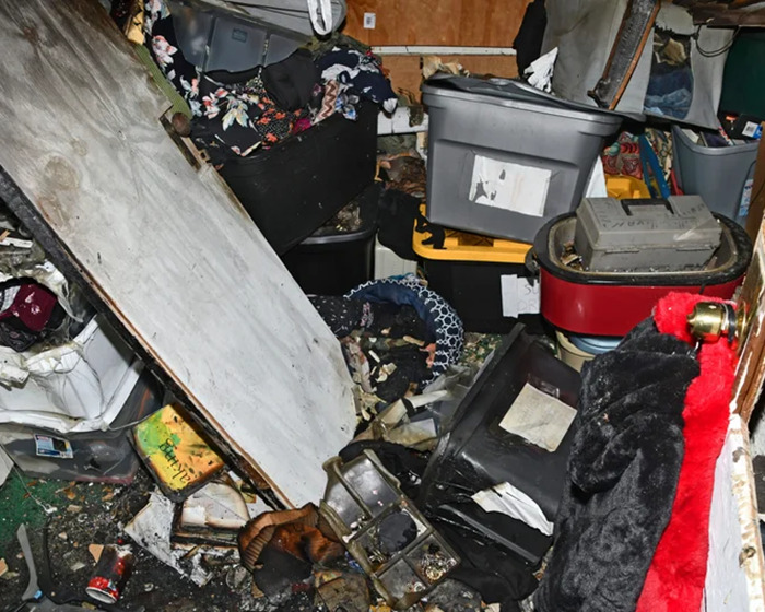 Cluttered room depicting chaos, related to man held captive by stepmom for 20 years.