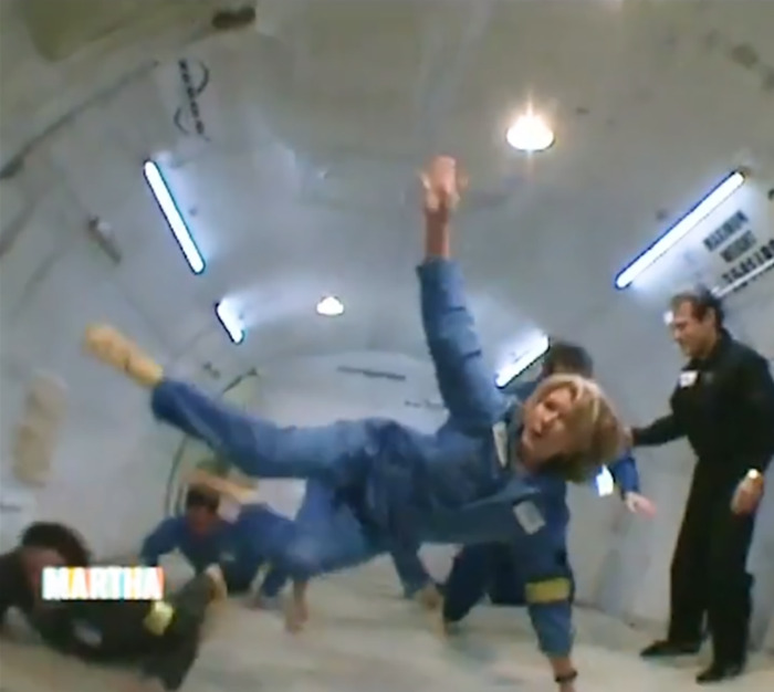 Martha Stewart in a blue jumpsuit, playfully floating in zero gravity, referencing Blue Origin astronauts.