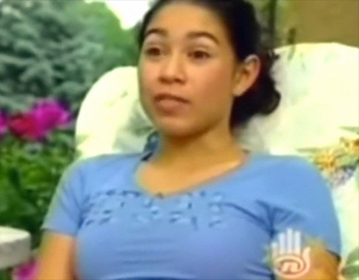 Young woman sharing a memorable celebrity encounter story, seated outdoors in a casual setting.