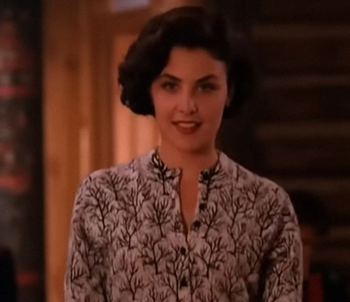 A person with short dark hair smiles in a patterned shirt, illustrating a memorable celebrity encounter.