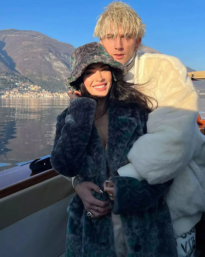 Couple embracing on a boat, with mountains in the background, related to baby name confusion topic.