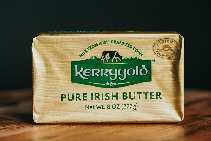 Kerrygold Pure Irish Butter on a wooden surface, an affordable treat that feels fancy.