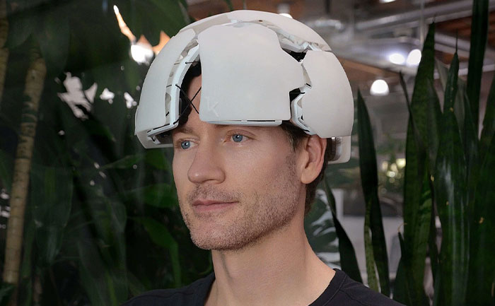 Man wearing a white futuristic helmet, a tech innovation that turned out to be a flop.